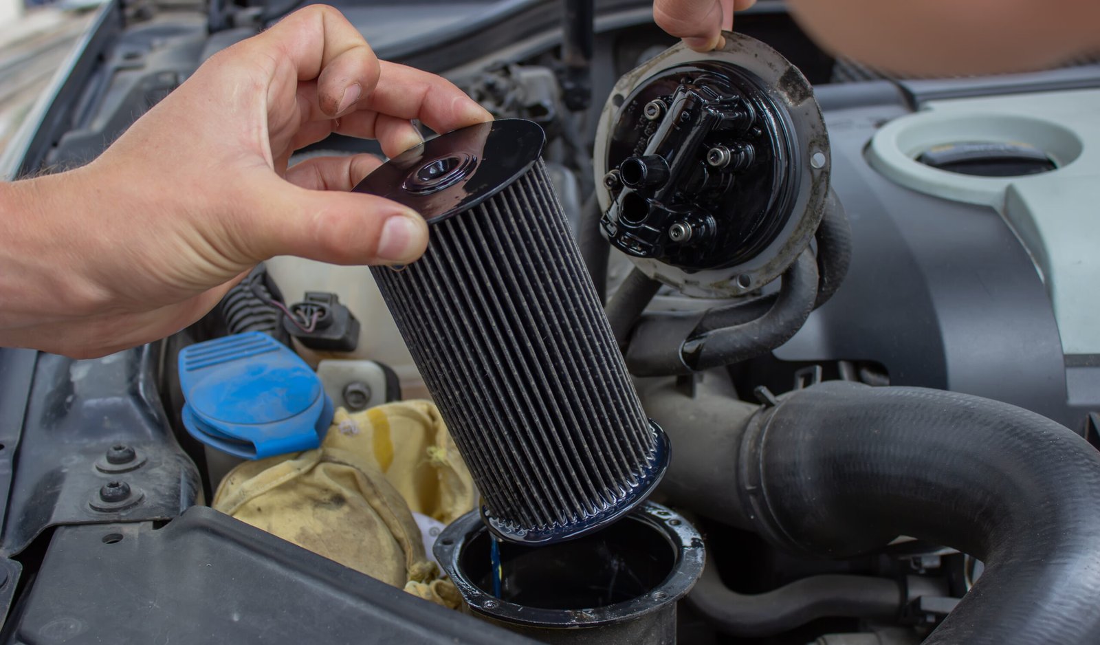 Car repair, filter replacement selective focus